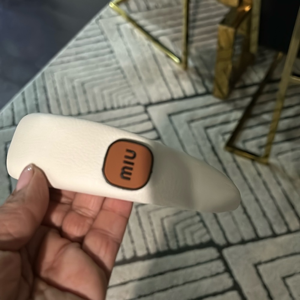 White leathery headband.